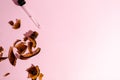 Banner natural organic cosmetic serum, oil in a brown broken glass pipette bottle closeup on a pink background with