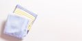 Banner. Newborn striped clothes stack. Copy space