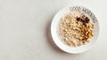 Banner oatmeal porridge with chocolate and nuts on a plate that says good morning. Healthy food, Breakfast. Copy space