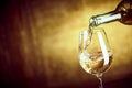 Banner ofPouring a glass of white wine from a bottle Royalty Free Stock Photo