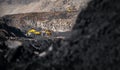 Banner Open pit mine industry, excavator loading coal on big yellow mining truck for anthracite Royalty Free Stock Photo