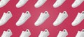 Banner pattern of white sneakers isolated on Viva Magenta background.