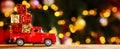 Banner photo of red small retro toy truck with christmas gifts Royalty Free Stock Photo