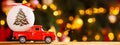 Banner photo of red small retro toy truck with white christmas ball Royalty Free Stock Photo