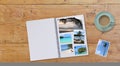 Banner Photobook Album on Wooden Table background with Travel Photos and Coffee or Tea in Cup