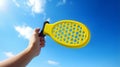 banner pickleball game, hands over blue sky hitting pickleball yellow ball Royalty Free Stock Photo