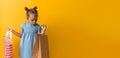 Banner Portrait Caucasian Beautiful Happy Little Preschool Girl Smiling Cheerful And Holding Cardboard Bags Isolated On Royalty Free Stock Photo