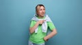 banner portrait of a positive bright girl in a casual outfit on a blue background with copy space