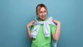 banner portrait of a positive bright girl in a casual outfit on a blue background with copy space