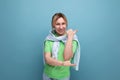 banner portrait of a positive bright girl in a casual outfit on a blue background with copy space