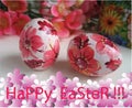 A postcard, or a banner with the words `Happy Easter`, is made in pink tones.