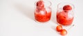 Red berry lemonade in glass jar on a wooden background with lemon slices, honey and ice. Top view Royalty Free Stock Photo