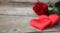 Banner. Red roses flowers with red hearts on old wooden background. Romantic Valentines holidays concept. Copy space. Top view Royalty Free Stock Photo