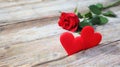 Banner. Red roses flowers with red hearts on old wooden background. Romantic Valentines holidays concept. Copy space. Top view Royalty Free Stock Photo