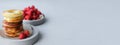 Banner. Round baked donut with strawberries on a gray concrete background. Minimalism. Copy space.