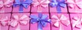 Banner Rows of boxes with gifts decoration ribbon satin bow pink A top view of Flat lay