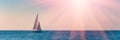 Banner 3:1. Sailboat in the sea in the evening sunlight over sky background. Luxury summer adventure or active vacation concept. Royalty Free Stock Photo