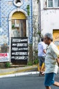 Banner in Salvador - vertical viewTranslation: How many need to die to invest in house renovations Royalty Free Stock Photo