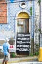 Banner in Salvador - vertical viewTranslation: How many need to die to invest in house renovations Royalty Free Stock Photo