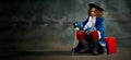 Banner with serious thoughtful little girl wearing costume of prince, musketeer posing over dark vintage style