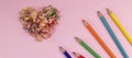 banner with Sharpened colored pencils and heart-shaped pencil shavings. Decoration for St. Valentine's Day. Royalty Free Stock Photo