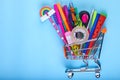 Banner of Shopping cart with school supply on a blue background with copy space. Back to school Royalty Free Stock Photo