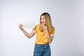 Banner sign woman peeking over edge of blank empty paper billboard with copy space for text. Beautiful Asian Caucasian Royalty Free Stock Photo