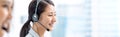 Banner of smiling telemarketing Asian woman in call center Royalty Free Stock Photo