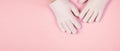 Banner with spa gel moisturizing gloves pink background with copy space for design. Skin care and beauty routine concept Royalty Free Stock Photo