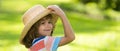 Banner with spring child face. Portrait of cheerful child in summer nature park. Cute joyful little boy kid. Close up Royalty Free Stock Photo