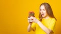 Banner. Teen girl screams in pain, pricked by a cactus on a yellow background. Stress and health concept.