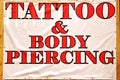 Banner with text TATTOO & BODY PIERCING Royalty Free Stock Photo