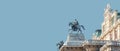 Banner with top roof sculpture of Greek goddess Muse riding Pegasus, a winged horse, at Vienna State Opera House, Vienna, Austria