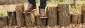 Banner of Top view man standing with hiking mountain boots on autumn leaves and wood background Royalty Free Stock Photo