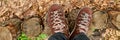 Banner of Top view man standing with hiking mountain boots on autumn leaves and wood background Royalty Free Stock Photo