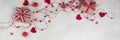 banner of two gifts with red ribbon on white textured background with red beads with hearts. background for Royalty Free Stock Photo