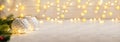 Banner with two white candlesticks with burning canles flame with garland lights. Christmas decoration