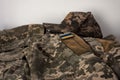 A banner of the Ukrainian flag on a soldier's pixel camouflage uniform. Ukrainian soldier uniform