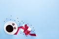 Banner of Valentine`s Day. A Cup of coffee, a gift box and a heart-shaped chocolate on a blue background Royalty Free Stock Photo