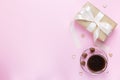 Banner of Valentine`s Day. A Cup of coffee, a gift box and a heart-shaped chocolate on a pink background Royalty Free Stock Photo
