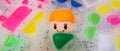 Banner washing of children toys, plastic building blocks with figurines. A smiling little fellow and colorful cubes float in the Royalty Free Stock Photo
