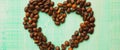 banner for website, coffee beans on brown matter, the heart of the coffee beans, background