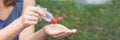 BANNER Women`s hands using wash hand sanitizer gel pump dispenser Long Format Royalty Free Stock Photo