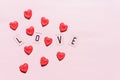 Banner.The word Love.Black letters Love with Red hearts.on pink background.Valentine's day. Loving, positive emotions Royalty Free Stock Photo