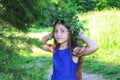 Banner with a young teen girl in wreath of wild flowers and background of nature Royalty Free Stock Photo