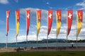 Banners of Geneva and Switzerland waving atop of their poles