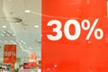 Banners With Signs Advertising Sale 30%, 50% in clothes store at Shopping Mall