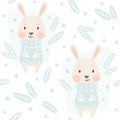 Banny baby winter seamless pattern. Cute hare in warm sweater Christmas background.