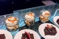 Banoffee dessert in glass jars topped with whipping cream along