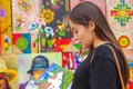 BANOS, ECUADOR, AUGUST, 17, 2018: Beautiful young woman holding an artesania in a shopstore in Banos, Ecuador. Banos is Royalty Free Stock Photo